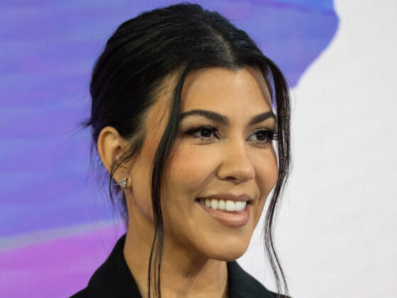 Kourtney Kardashian flashes her massive bare baby bump in skintight black crop top as she awaits baby’s due date