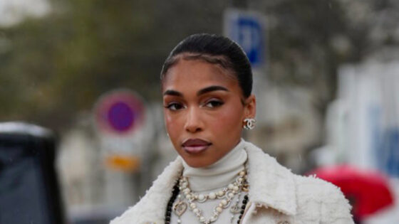 Lori Harvey shows off her incredible legs in Chanel skirt and thigh-high boots at fashion show in Paris