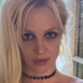 Britney Spears goes topless in nothing but a necklace as she pulls funny faces in bed for bizarre video at LA mansion