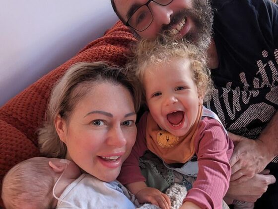 Natalie Austin, 40, (pictured left holding baby Darcy) who lives in Ash in Kent, with her husband Rob, 39, (pictured right) didn’t know she could conceive - her first child, Eloise, (pictured centre) was born after four cycles of IVF