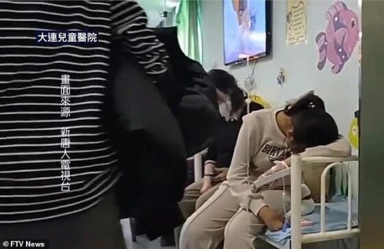 Hospitals in Beijing and Liaoning are among those 'overwhelmed with sick children,' while school classes were 'on the verge of suspension'