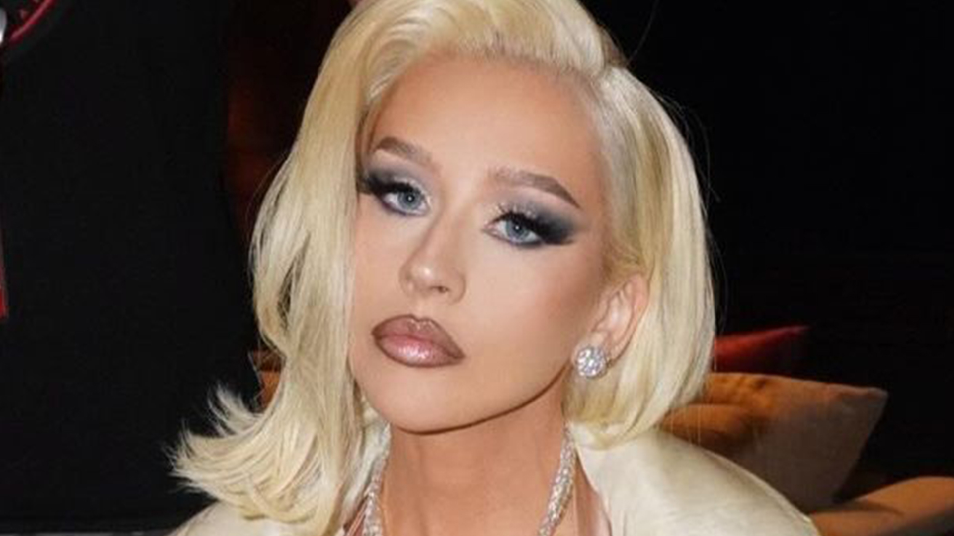 Christina Aguilera, 43, wears low-cut nude top and thigh-high white boots as fans gasp ‘are you kidding me?’