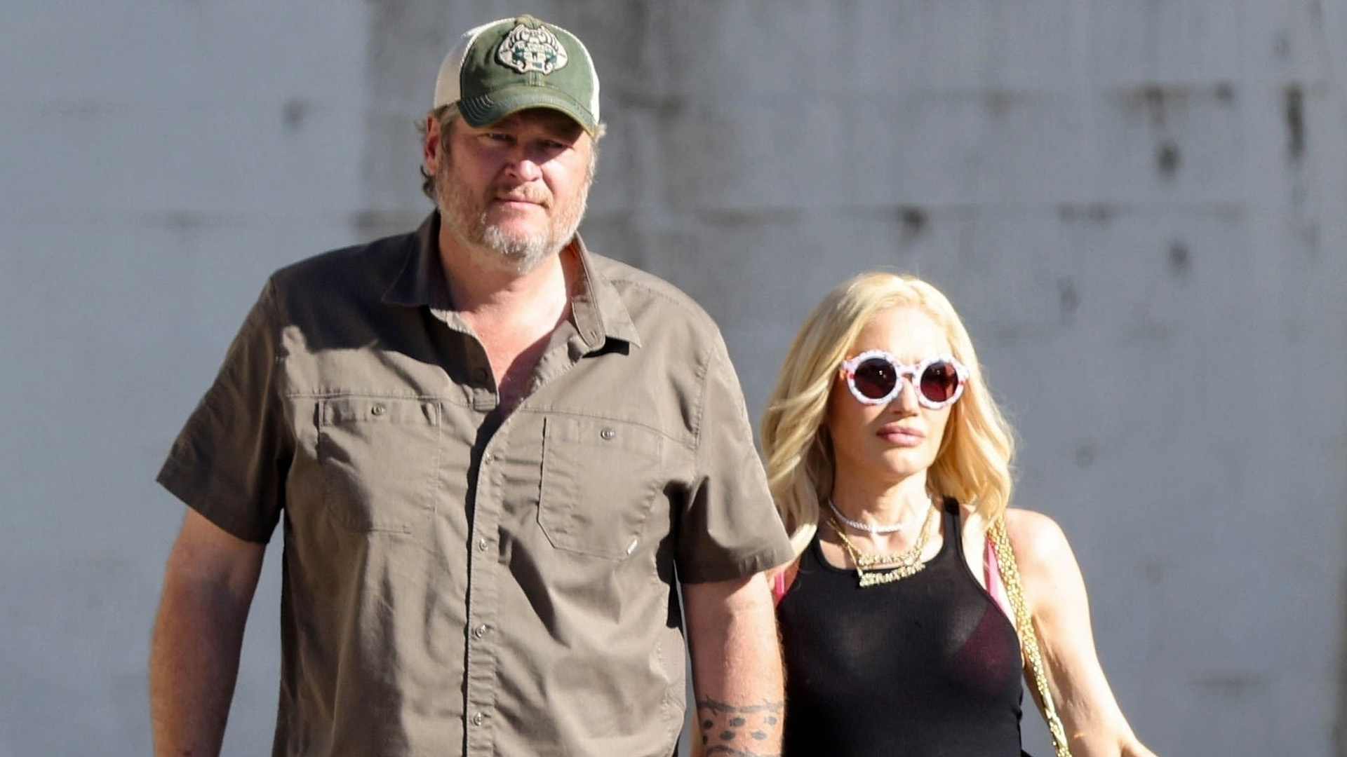 Gwen Stefani and Blake Shelton shut down split rumors as they hold hands and get close during rare public outing in LA
