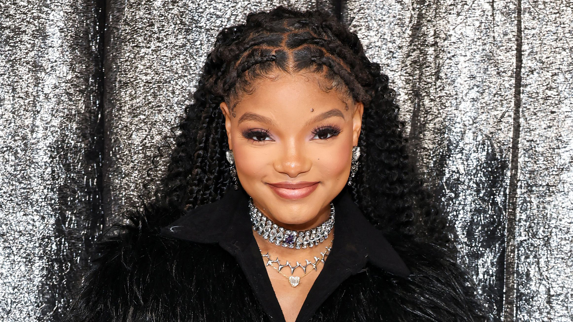 Halle Bailey shows off her post-baby body in a sports bra & skintight leggings just weeks after giving birth to son Halo