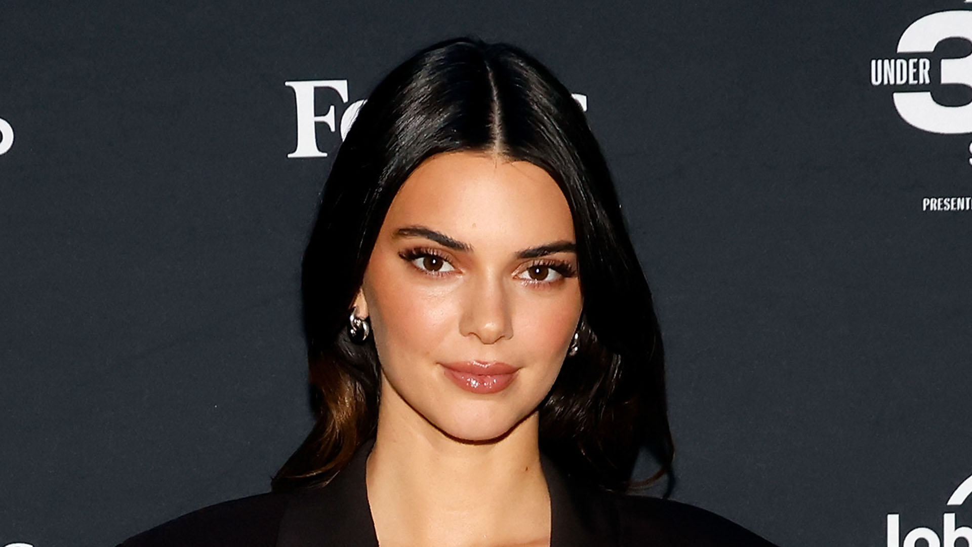 Kendall Jenner’s strapless top nearly slips off her thin frame after Kardashian fans suspect model ‘got a boob job’