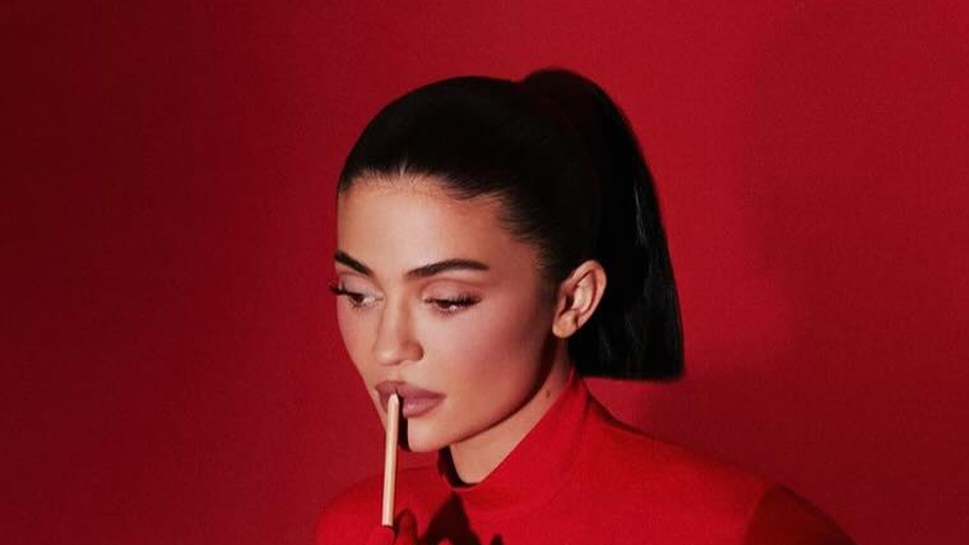 Kylie Jenner stuns in red skintight catsuit as she promotes new makeup item after fans think star ‘aged’ herself in ad