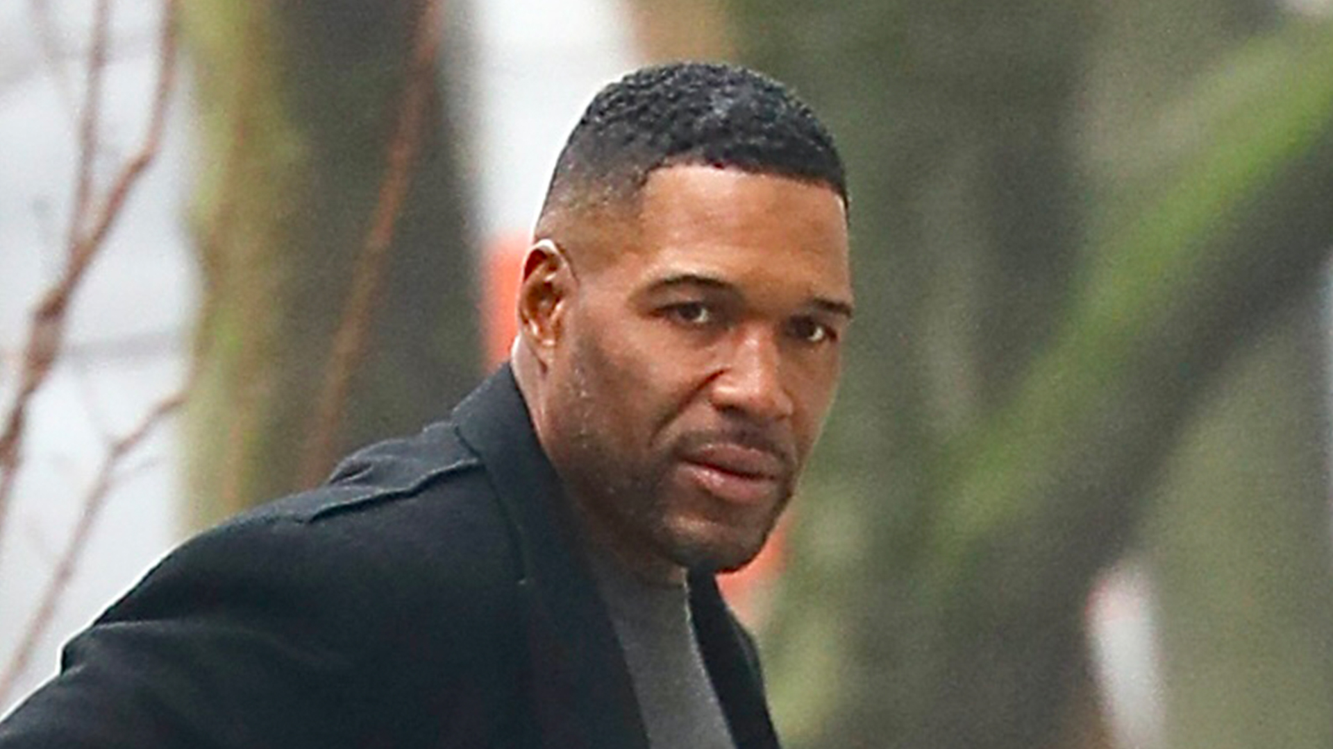 Michael Strahan looks worried on rainy day outing in NYC after daughter Isabella’s brain tumor battle