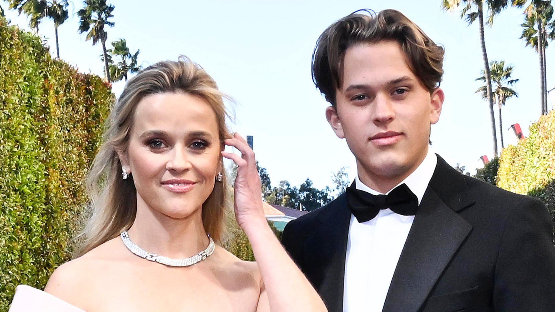 Reese Witherspoon, 47, shows off ageless beauty with rarely-seen son Deacon Phillippe, 20, as he attends Golden Globes