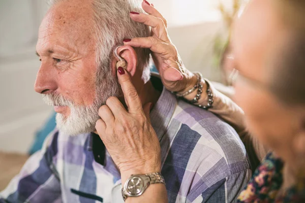 Wearing Hearing Aids and Longevity | Stock Photo