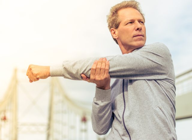 middle-aged man stretching