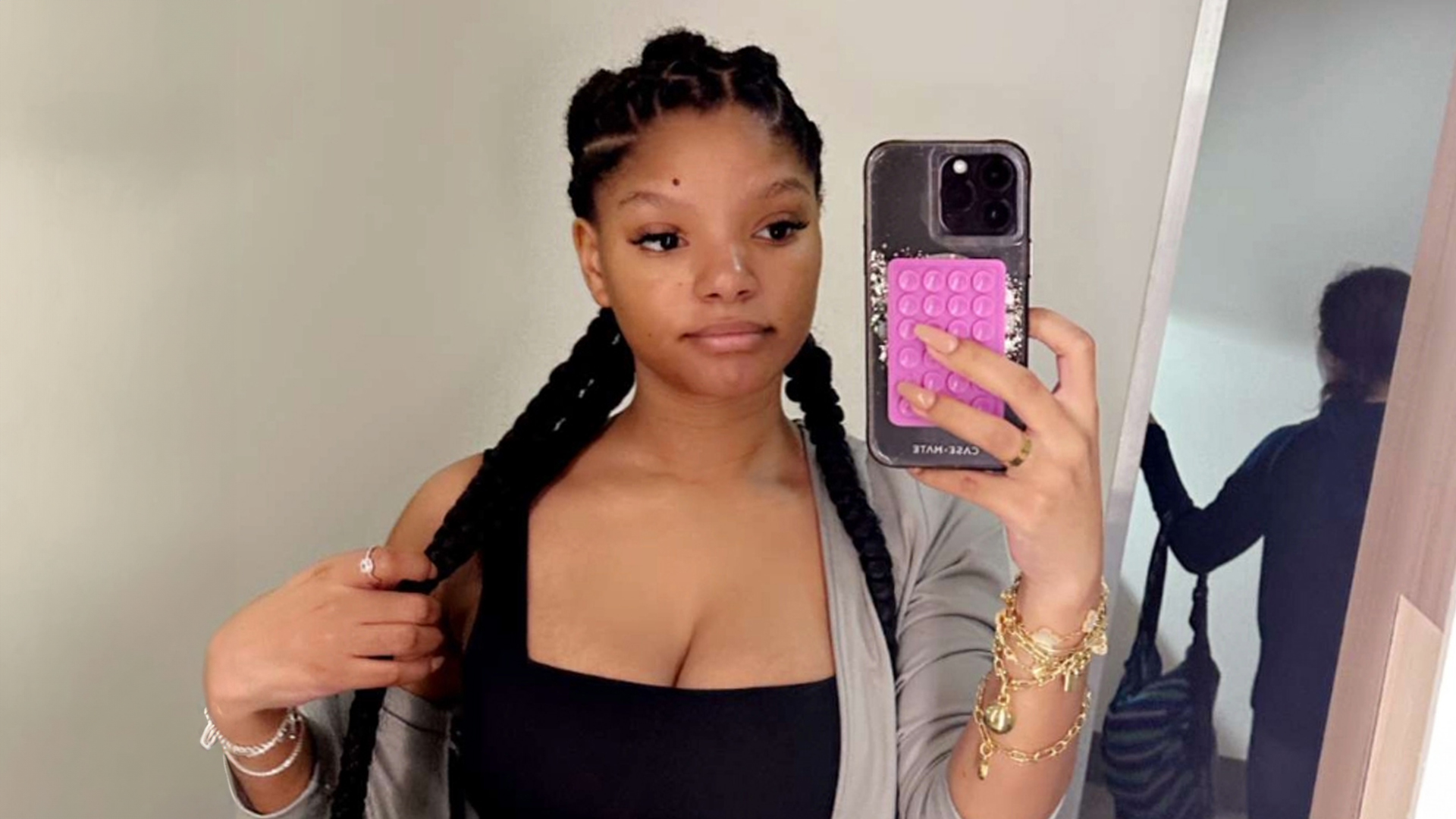 Halle Bailey shows off her post-baby body in a sports bra and skintight pants after giving birth to son Halo