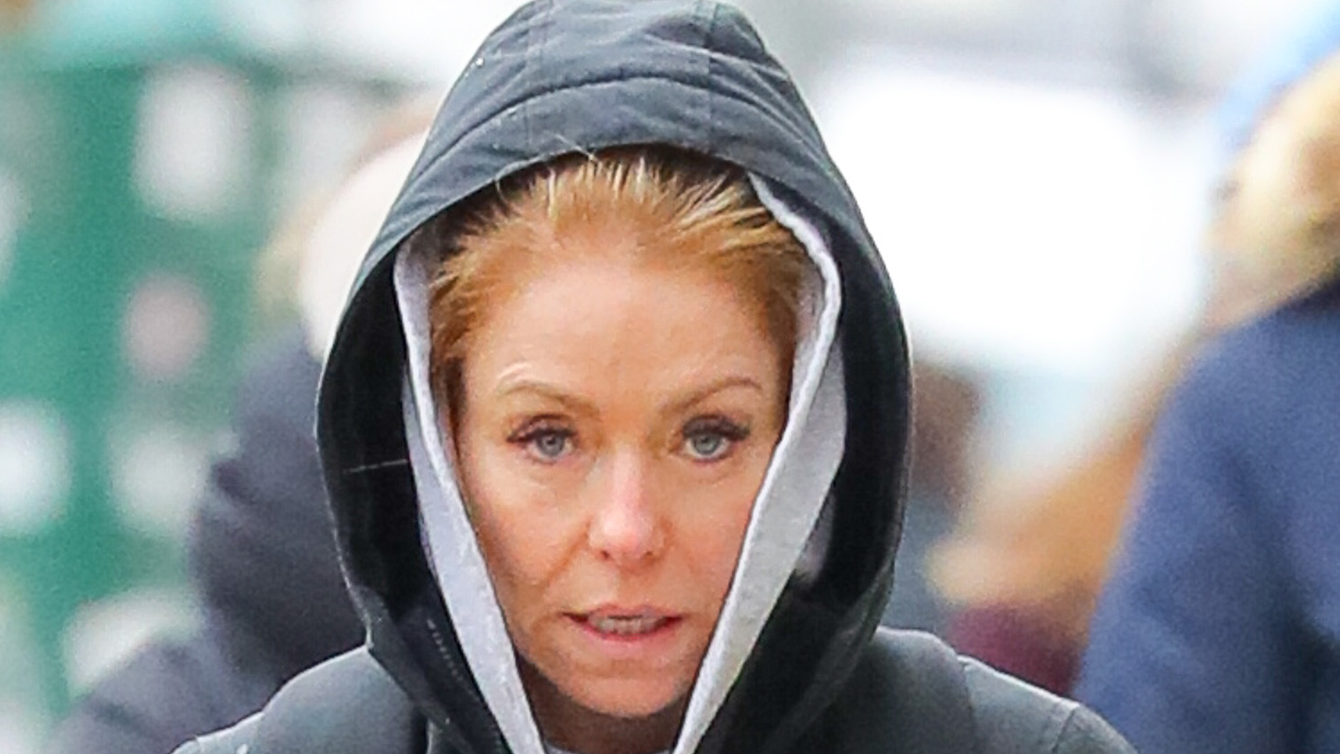 Kelly Ripa looks uncomfortable as she braves the frigid NYC snowstorm while walking around in $1.7k Moncler coat