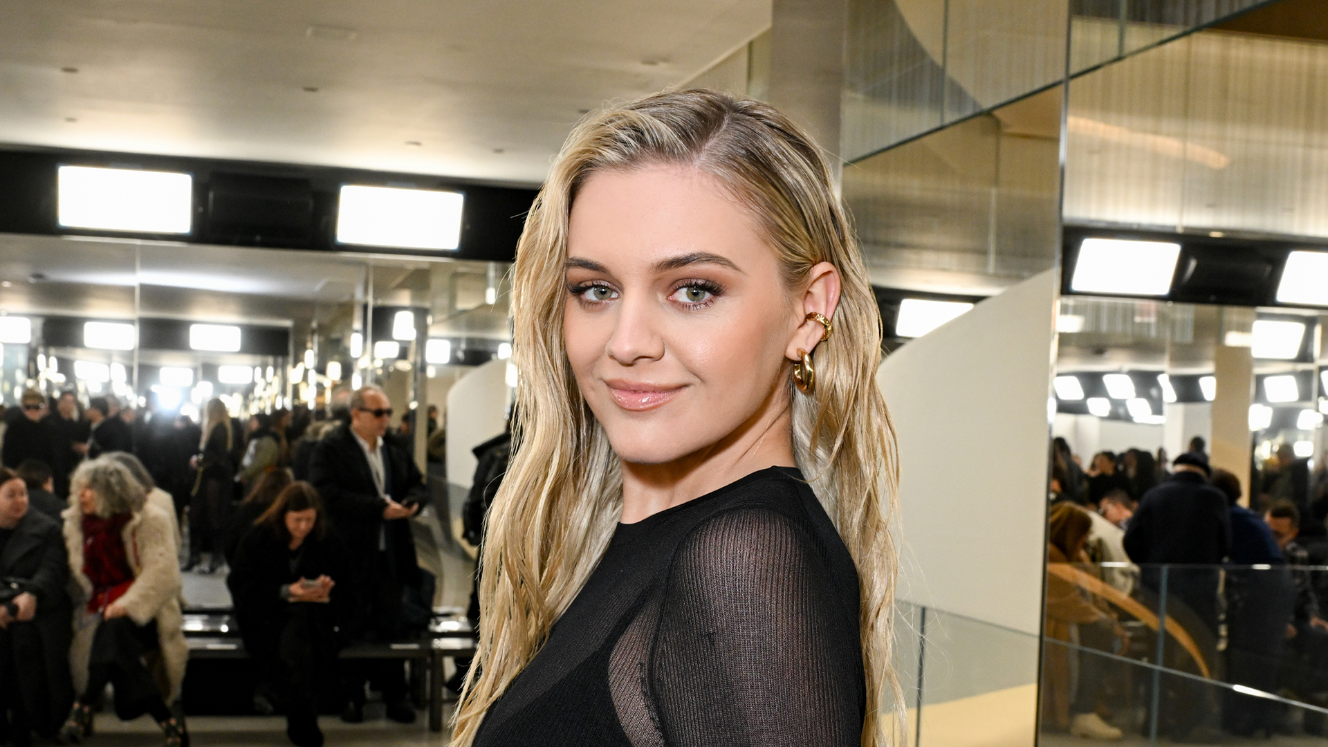 Kelsea Ballerini reveals all in a see-through black bodysuit at Michael Kors show in NYC