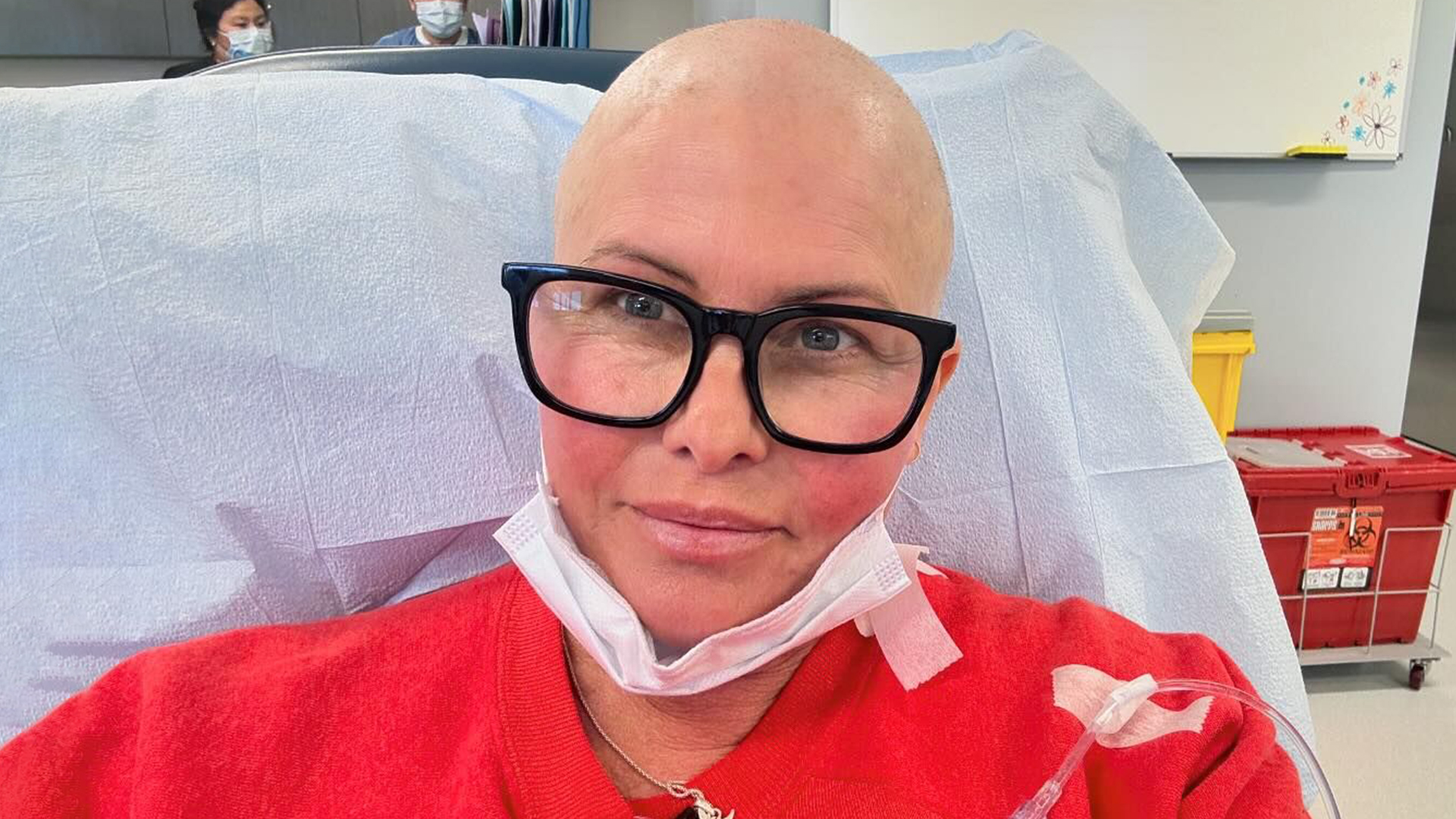 Baywatch star Nicole Eggert shaves her hair off and shares bald hospital selfie as she battles stage 2 breast cancer