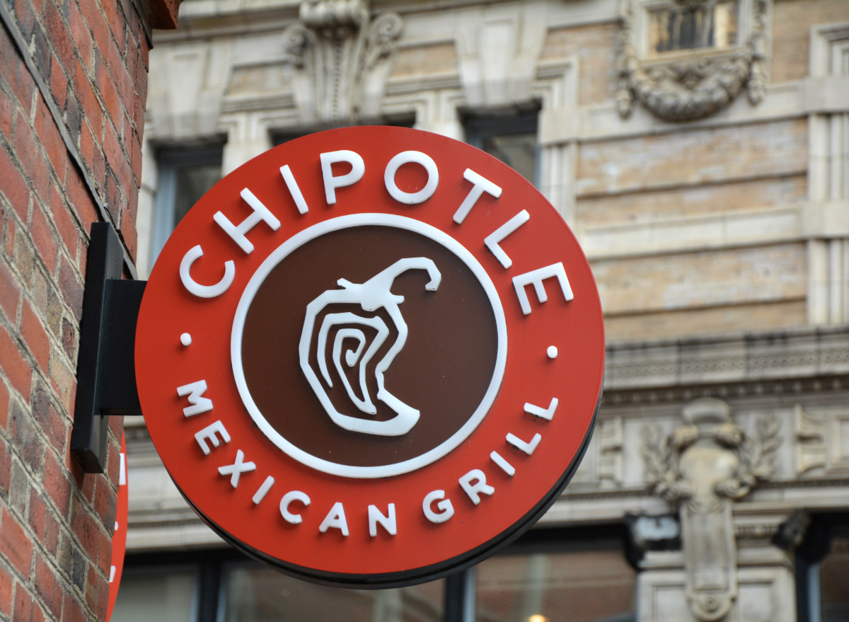 red chipotle sign attached to a brick building