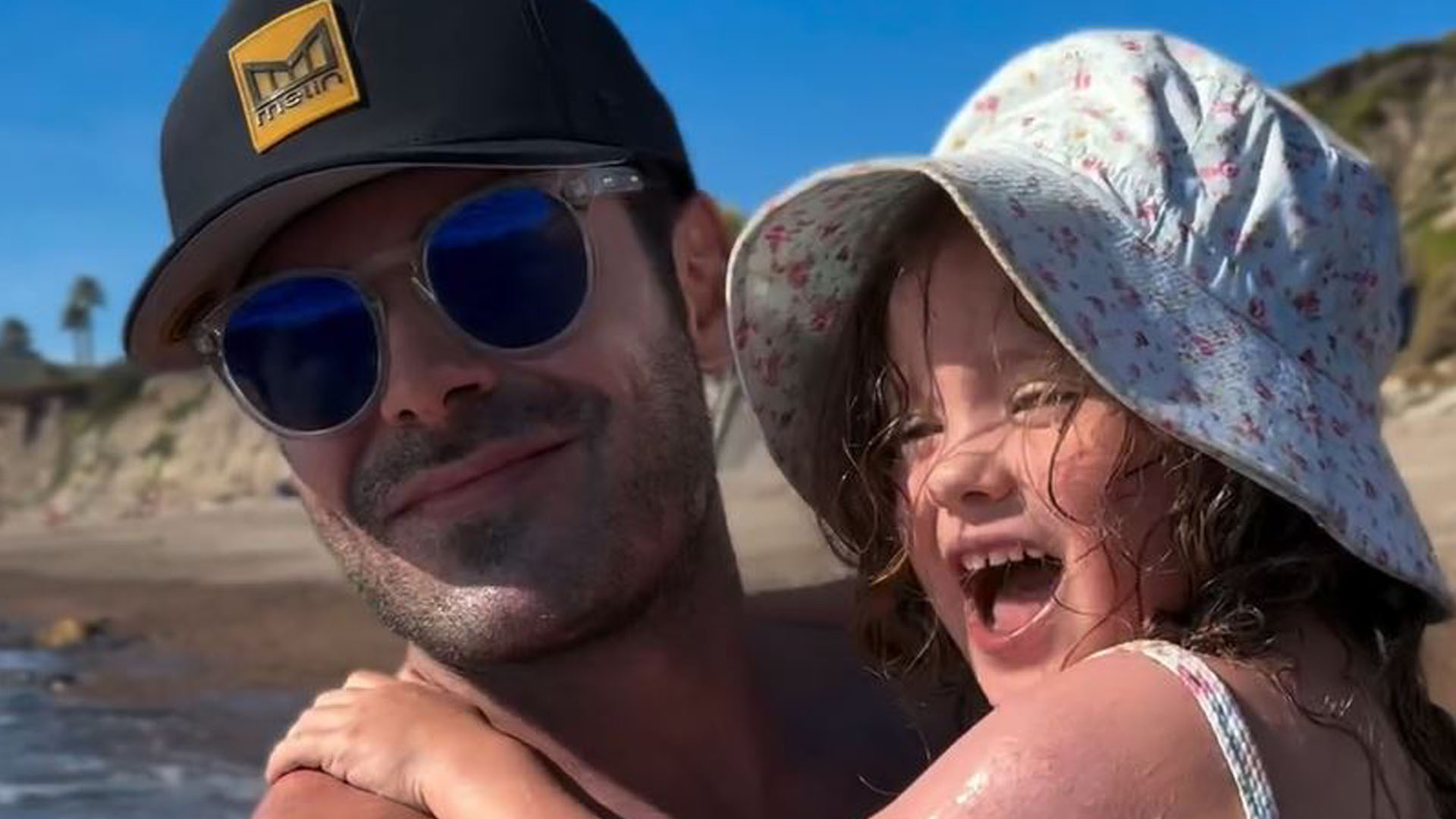 Zac Efron hits the beach with little sister Olivia, 4, and brother Dylan, 32, as fans beg ‘someone make him a father’