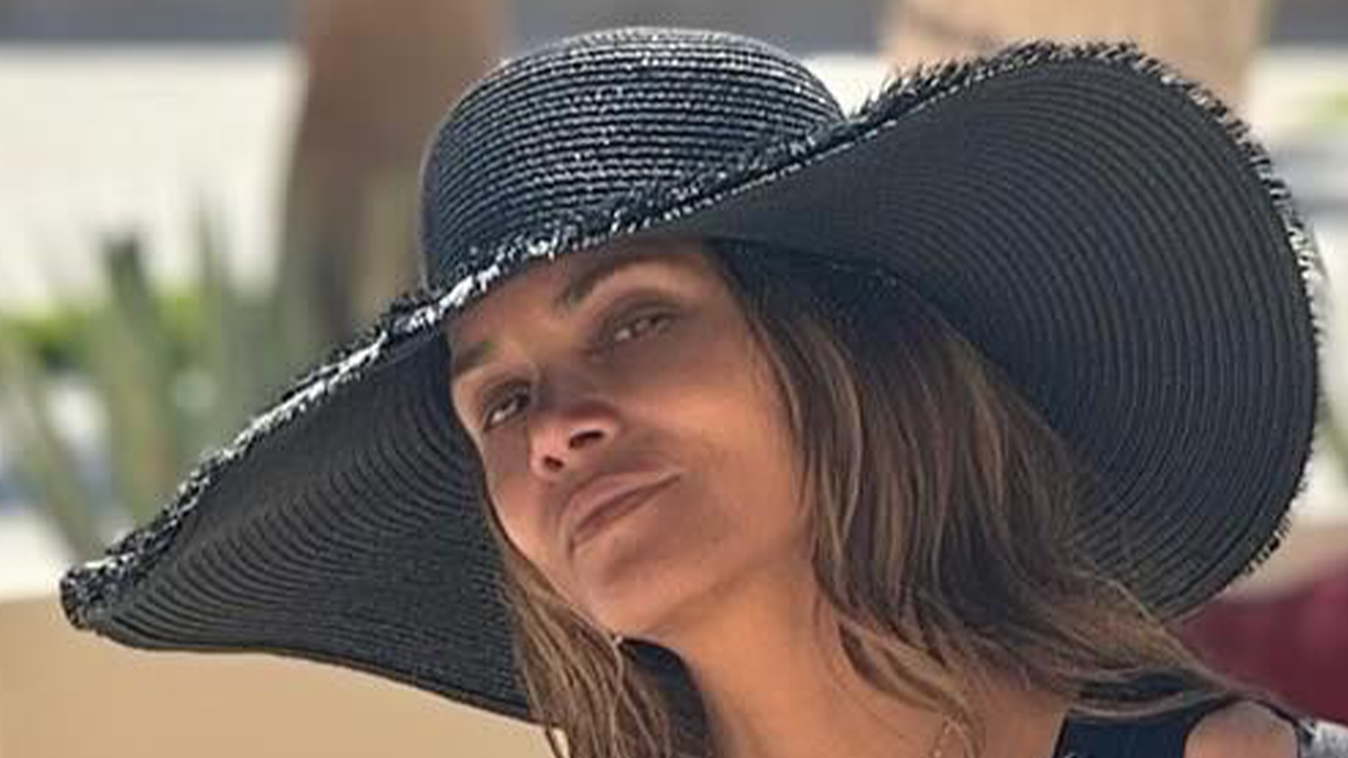 Halle Berry, 57, stuns in plunging black swimsuit on Cabo vacation as fans gush ‘time is on your side’