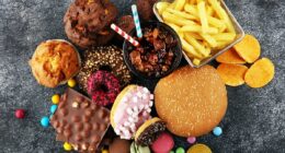 Scientists uncover missing link between junk food and cancer - which could explain explosion of tumors in young people