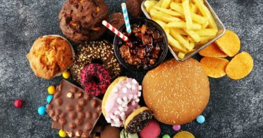 Scientists uncover missing link between junk food and cancer - which could explain explosion of tumors in young people