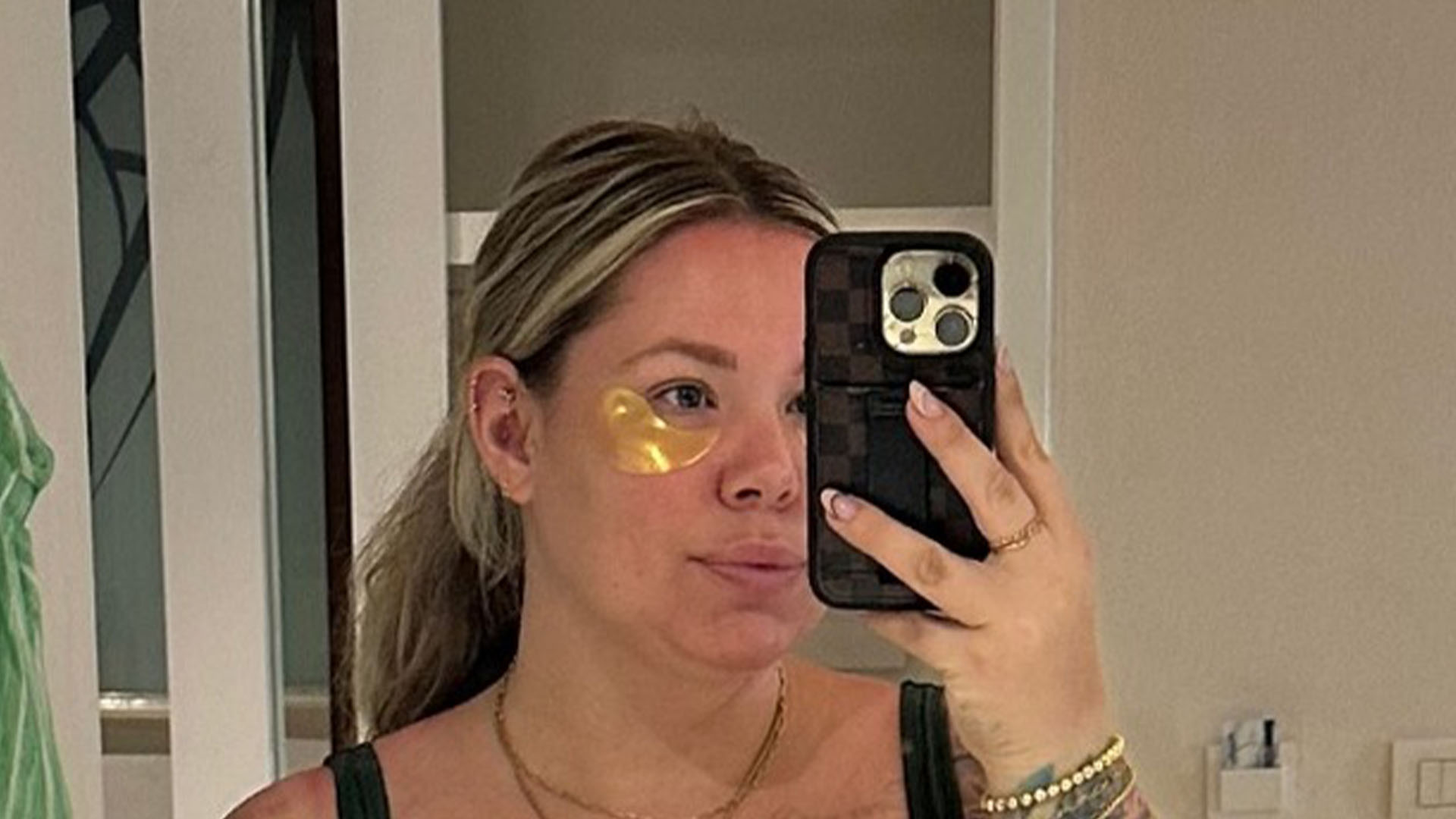 Teen Mom Kailyn Lowry puts body tattoos on full display in black sports bra as star enjoys vacation with kids