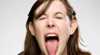 The red flag warning signs on your tongue that should trigger 'alarm bells'