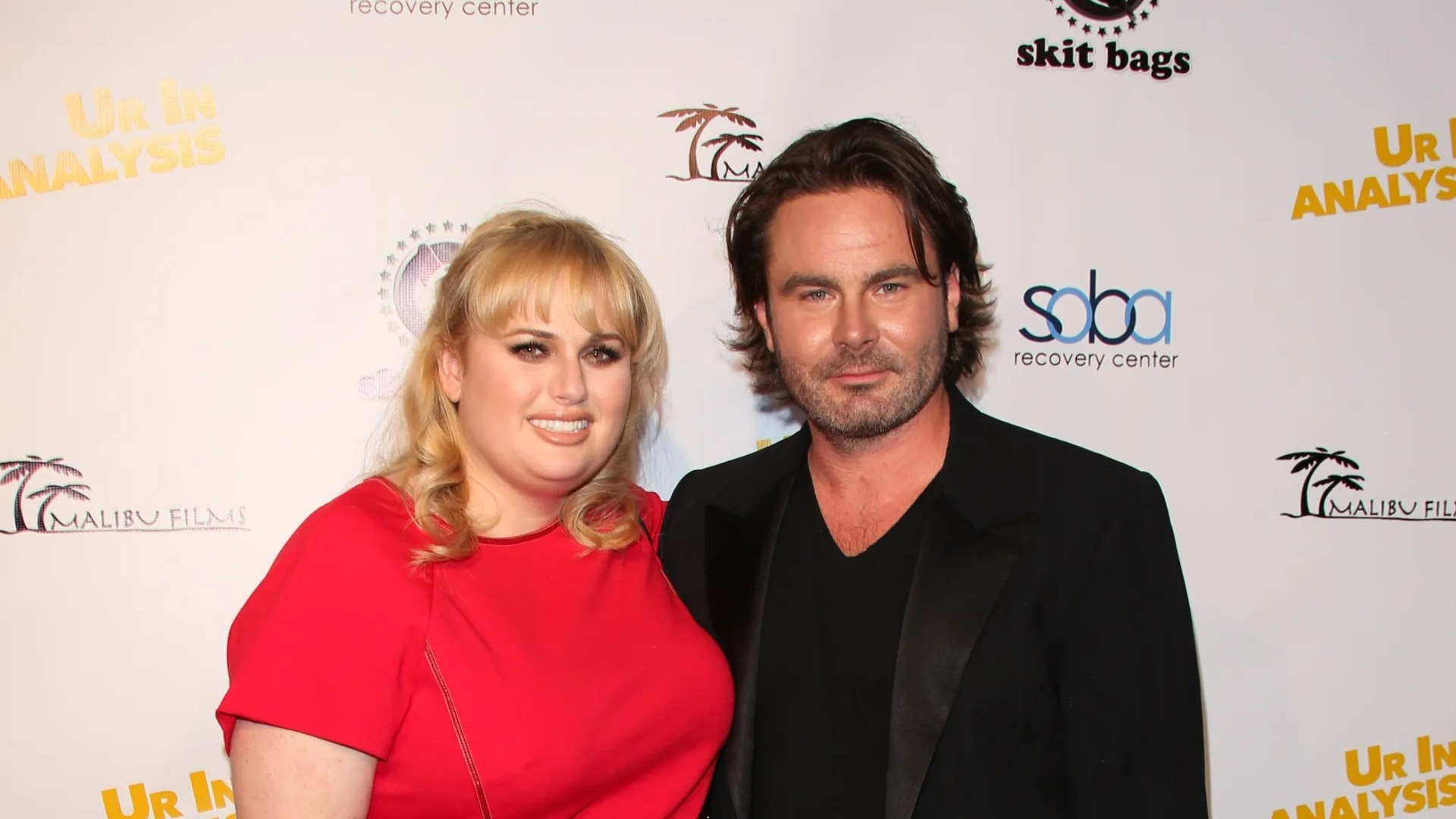 Who is Mickey Gooch Jr. and when did the actor date Rebel Wilson?