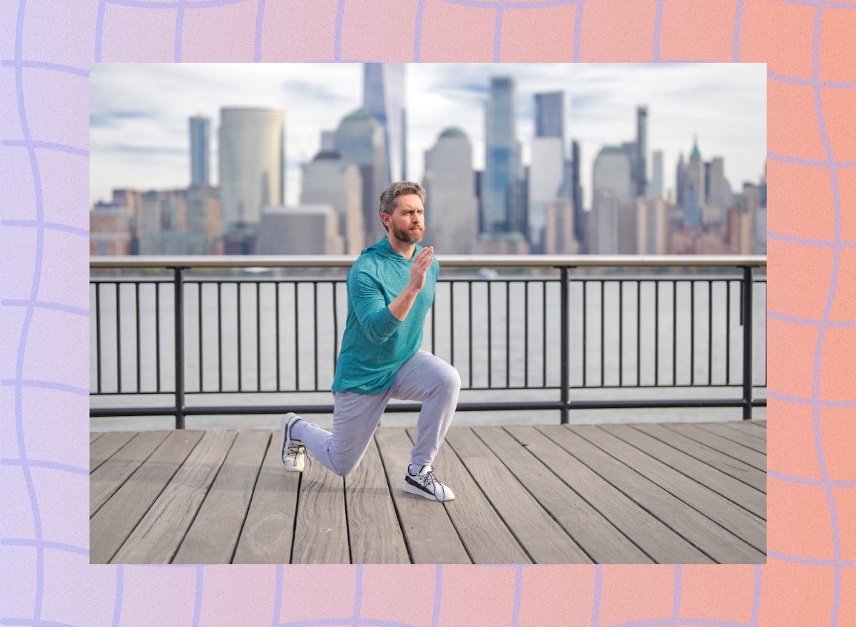 mature man doing lunge exercise outdoors along city waterfront