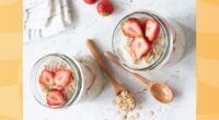 overnight oats with strawberries in two mason jars