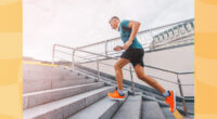 middle age man running up steps outside