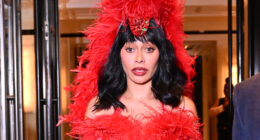 LaLa Anthony has large brownish mark on her rear end as she sports extravagant red feathered outfit in NYC