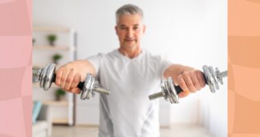 mature man lifting dumbbells at home