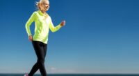 woman power walking by water