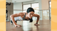 fit woman doing pushups at the gym