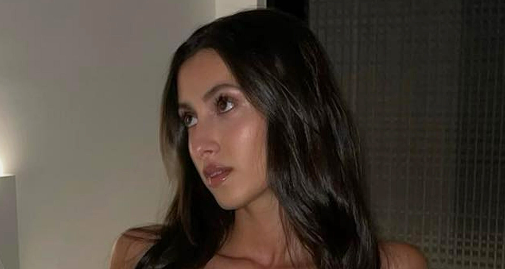 Bianca Censori’s lookalike sister Angelina wears cut-out crop top in moody selfies as dad shares concern for star