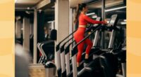 fit woman using a stair climber, StairMaster machine at the gym