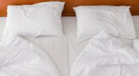 bed with two duvets and pillows