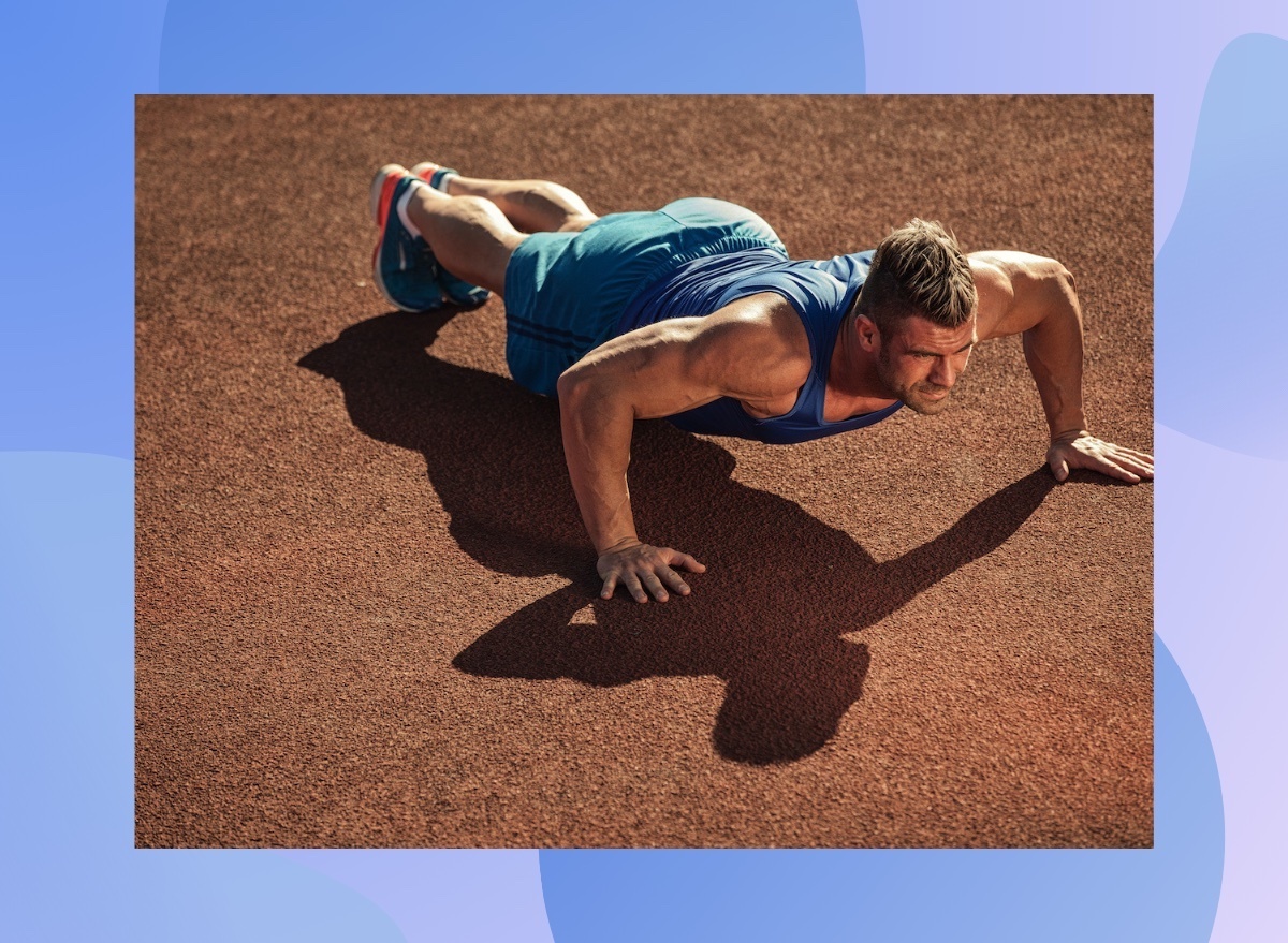 fit, muscular man doing pushups outdoors