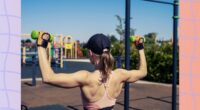 fit woman doing dumbbell shoulder presses outdoors near playground on sunny day