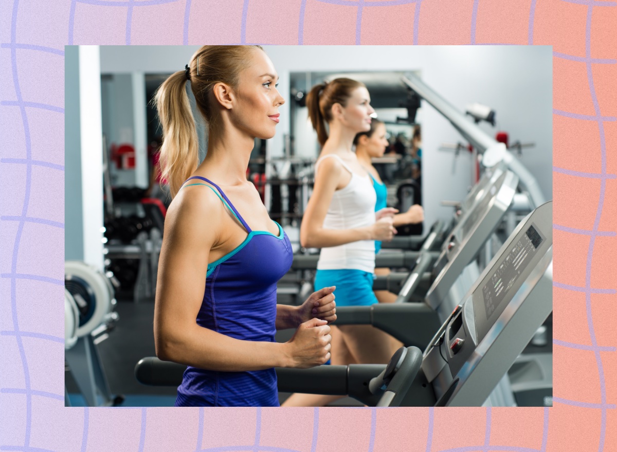 focused blonde woman walking on treadmill