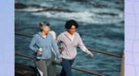 happy friends walking on boardwalk for exercise on cool, sunny day