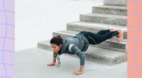 woman doing decline pushups on stairs outdoors