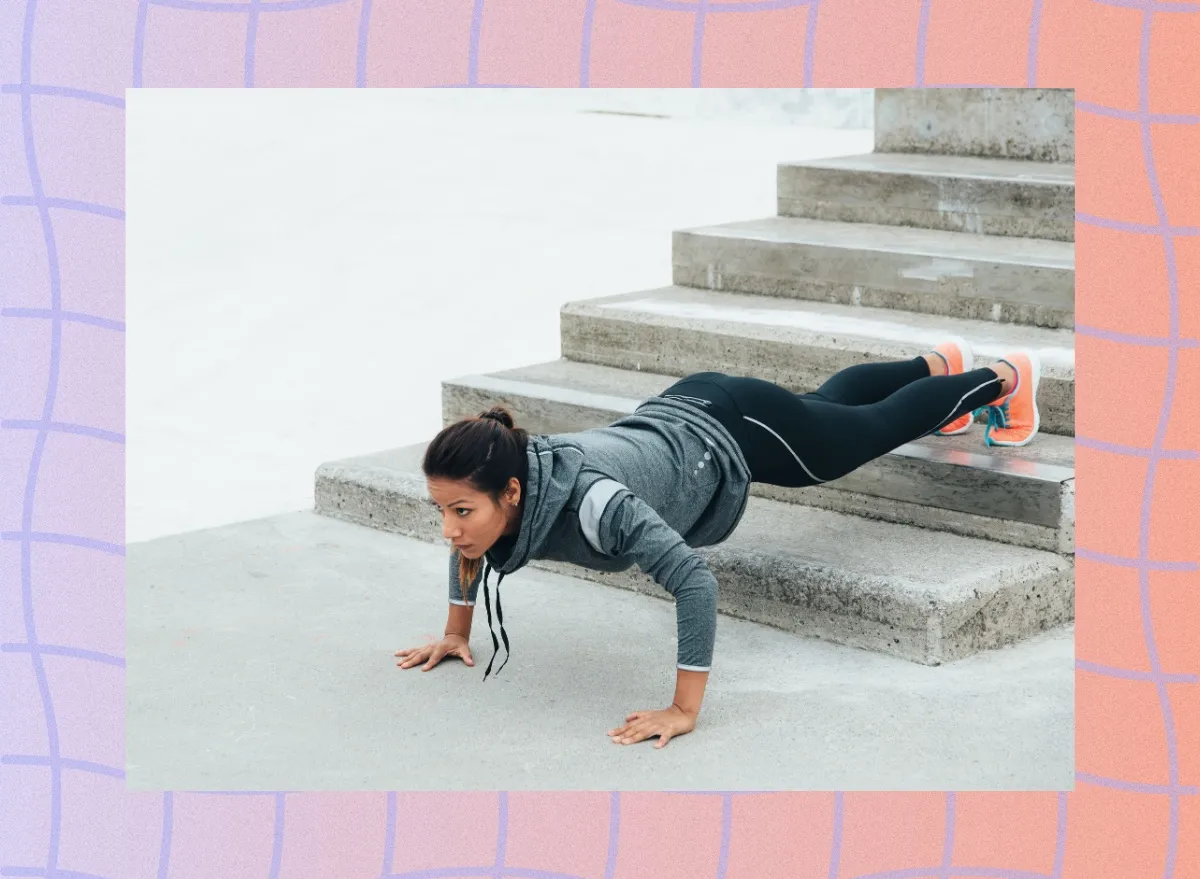woman doing decline pushups on stairs outdoors