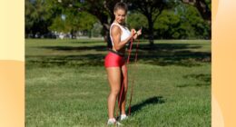 woman doing resistance band bicep curls