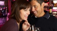 Couple Enjoying Drink Together In Bar