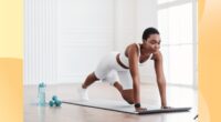 woman doing mountain climbers exercise in bright living space on a yoga mat