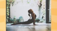 fit woman doing cobra pose in garden living space