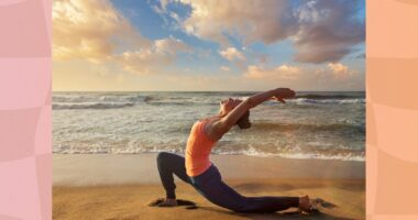 woman doing low or crescent lunge on the sand at the beach at sunset