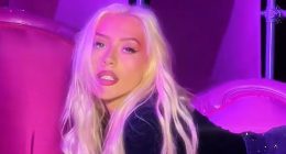 Christina Aguilera looks slimmer-than-ever as singer rolls around on couch in a mini skirt after 40lb weight loss