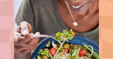 close-up of woman eating salad