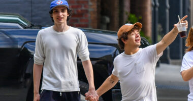 Finn Wolfhard and Gaten Matarazzo hold hands as they check out NYC real estate in filming break from Stranger Things 5